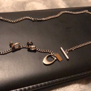 Coach earrings and necklace with signature “C”